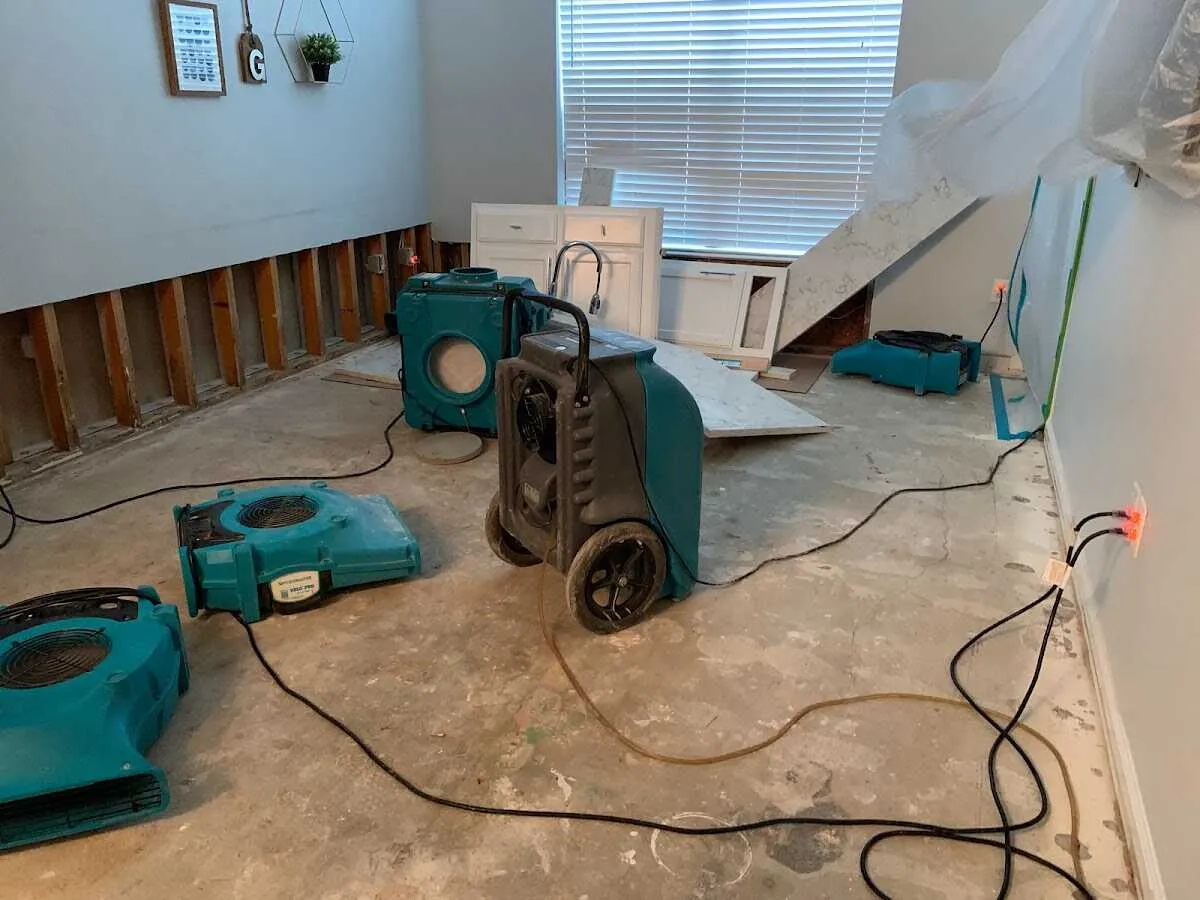 Dehumidifier in flood-cut room for Water Damage Restoration in Clark